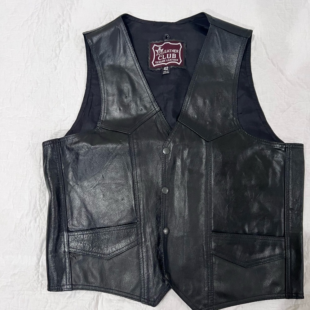 Men's black leather motorcycle vest.